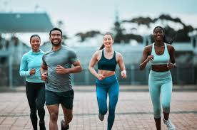 Sculpting Sleek Arms: The Essential Role of Cardio in Toning Without Bulking Up 3 image of people running to incorporate cardio West Bromwich exercise into their life to help tone arms and body.